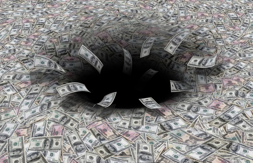 money disappearing down a black hole.