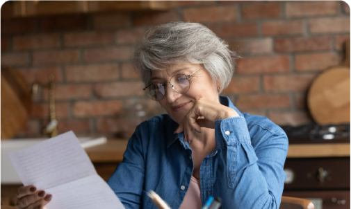 Elderly women reading document